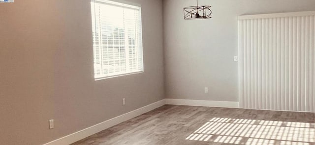 unfurnished room featuring wood-type flooring