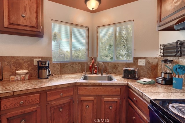 kitchen featuring sink and tasteful backsplash