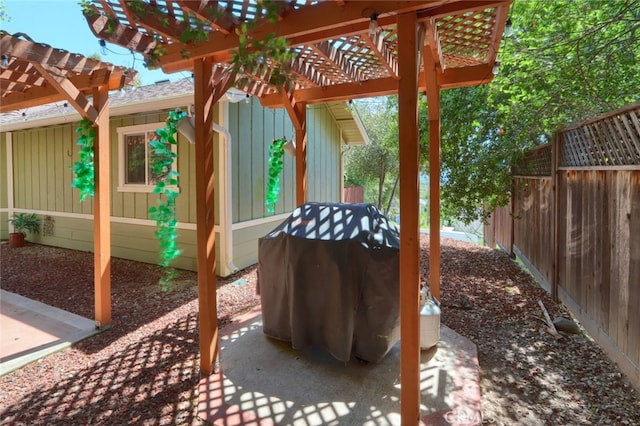 view of patio / terrace featuring a pergola and a grill