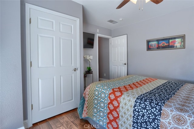 bedroom featuring hardwood / wood-style floors and ceiling fan