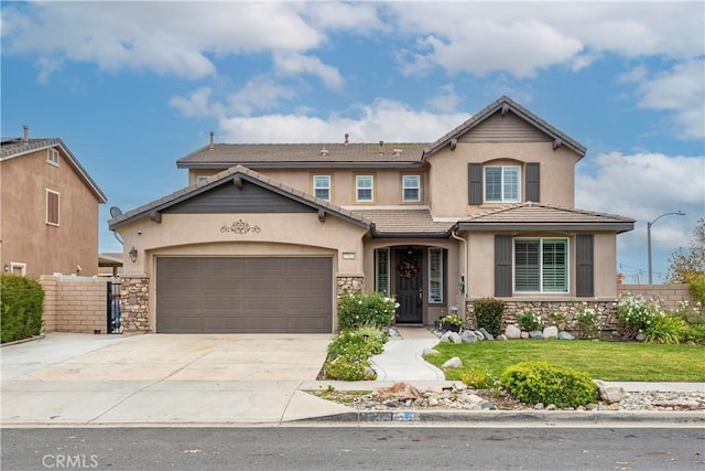 view of front of property with a front yard and a garage