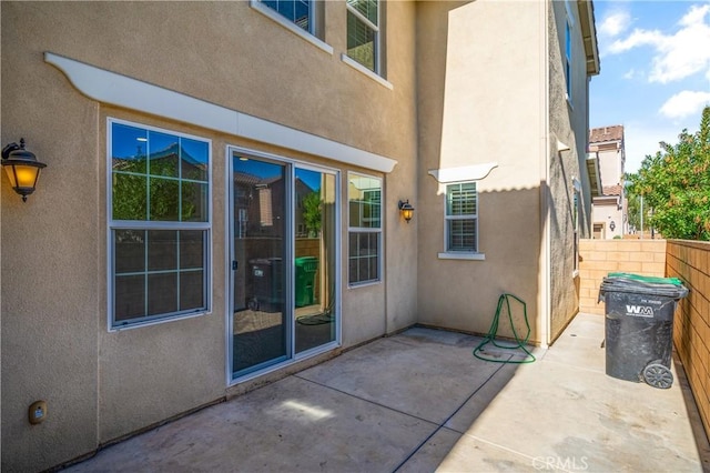 entrance to property with a patio