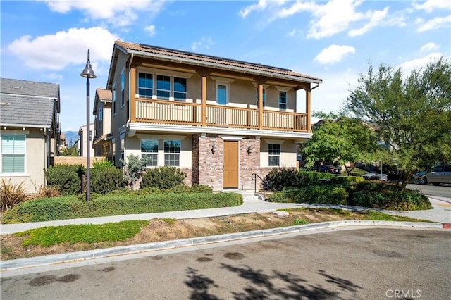 view of front of property with a balcony