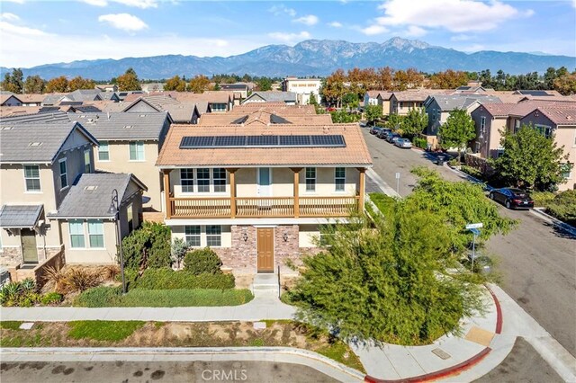 birds eye view of property featuring a mountain view