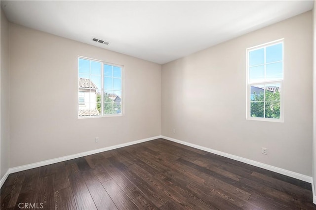 empty room featuring dark hardwood / wood-style floors