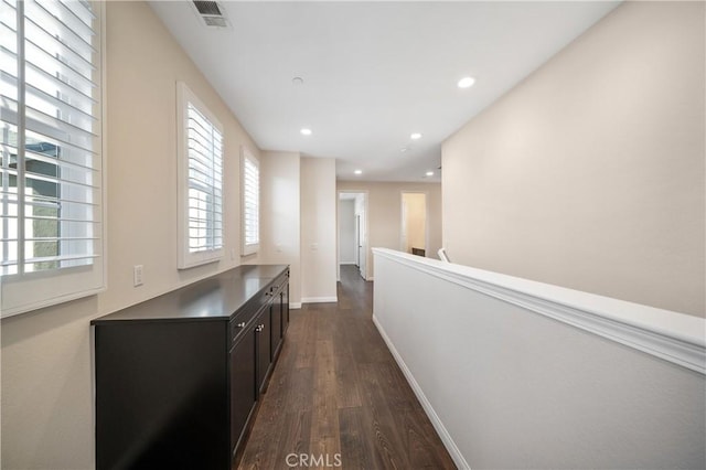 hall with dark hardwood / wood-style flooring