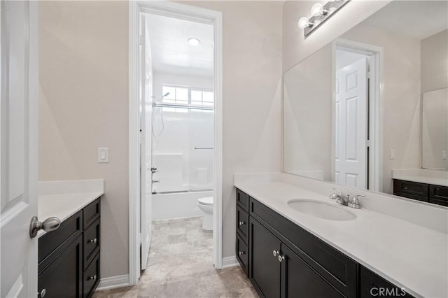 full bathroom featuring toilet, vanity, and shower / washtub combination