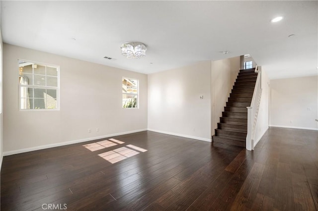 spare room featuring dark hardwood / wood-style flooring