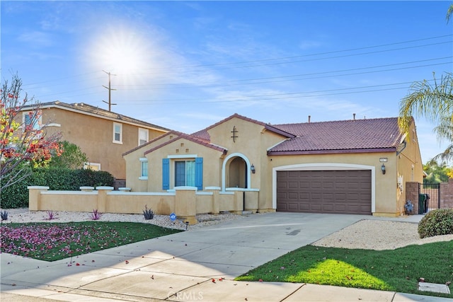 mediterranean / spanish-style house featuring a garage