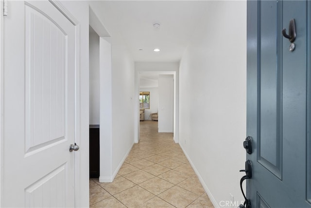 hallway featuring light tile patterned floors