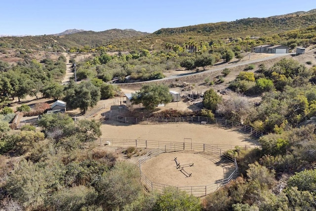 birds eye view of property featuring a mountain view and a rural view