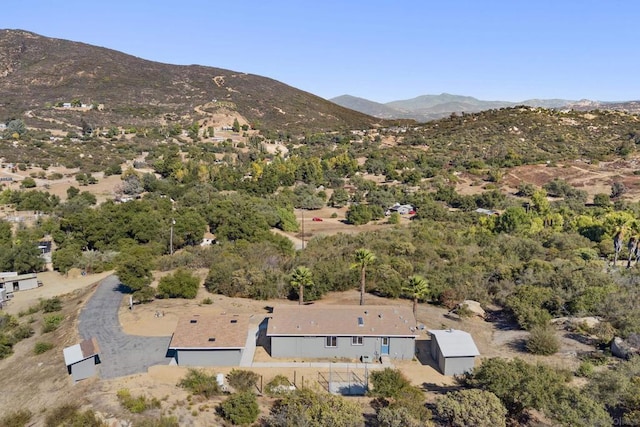 birds eye view of property featuring a mountain view