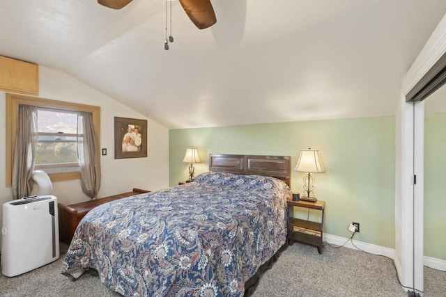 bedroom with ceiling fan, light carpet, and lofted ceiling