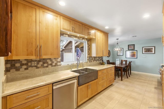 kitchen with stainless steel dishwasher, decorative backsplash, pendant lighting, and sink