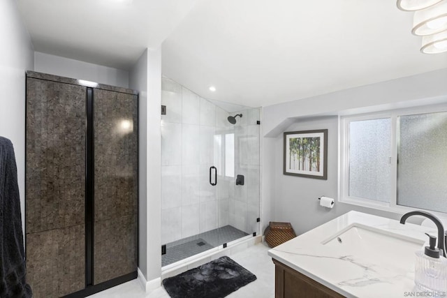 bathroom with vanity and an enclosed shower