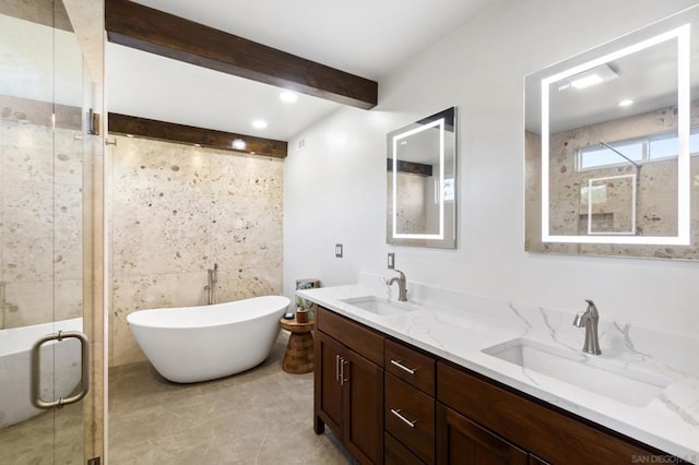 bathroom featuring tile patterned floors, vanity, tile walls, and independent shower and bath