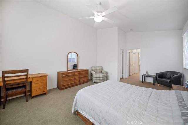 carpeted bedroom featuring ceiling fan and lofted ceiling