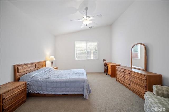 carpeted bedroom featuring ceiling fan and vaulted ceiling