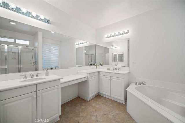 bathroom featuring tile patterned floors, vanity, and independent shower and bath