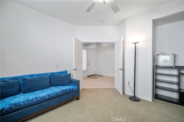 living room featuring carpet flooring and ceiling fan