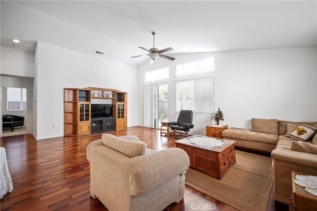 living room with dark hardwood / wood-style floors, vaulted ceiling, and ceiling fan