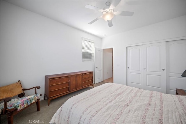 carpeted bedroom featuring a closet and ceiling fan