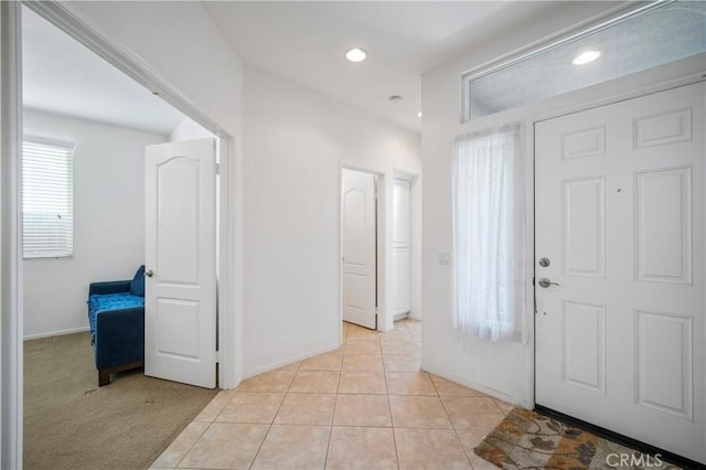 foyer featuring light tile patterned floors