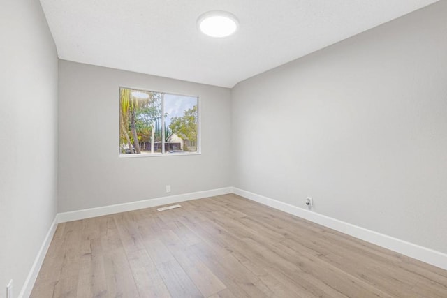 empty room with light wood-type flooring