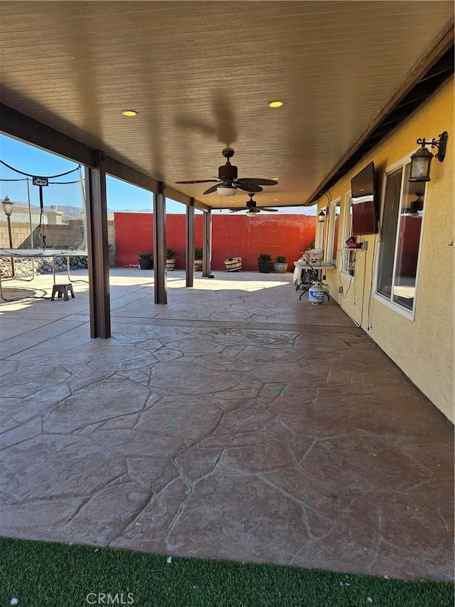 view of patio / terrace featuring ceiling fan