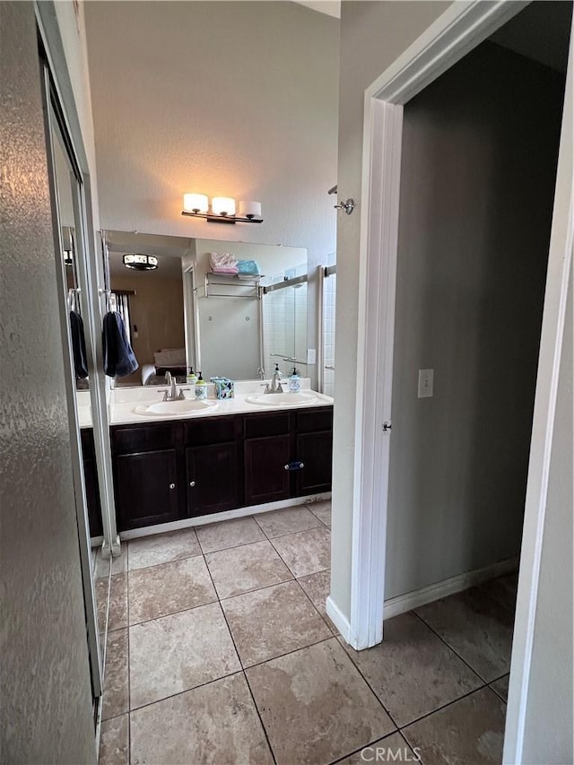 bathroom featuring tile patterned floors and vanity