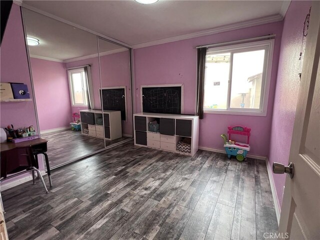 living room featuring dark hardwood / wood-style flooring and ornamental molding