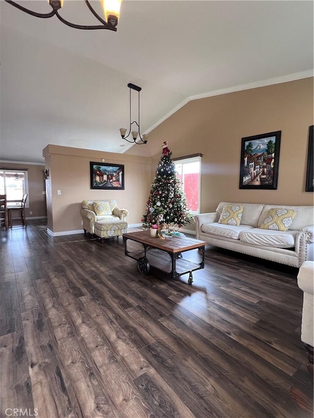 living room featuring a wealth of natural light, lofted ceiling, ornamental molding, and dark hardwood / wood-style floors