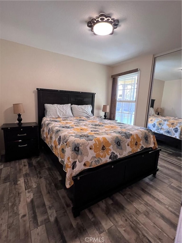 bedroom featuring dark hardwood / wood-style flooring