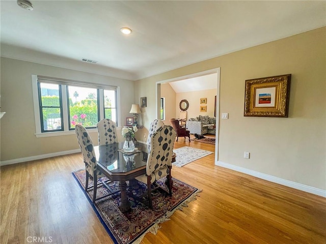 dining space featuring light wood-type flooring