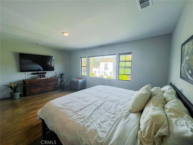 bedroom featuring dark hardwood / wood-style flooring