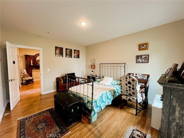 bedroom with wood-type flooring