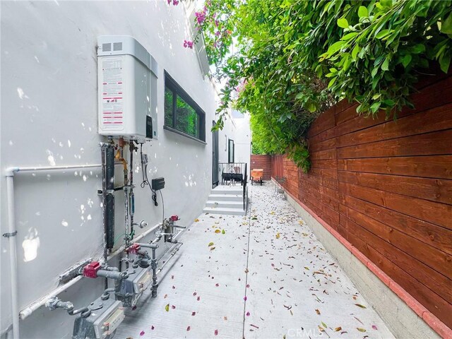 view of patio with tankless water heater