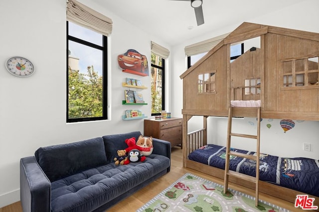 interior space featuring ceiling fan, light hardwood / wood-style flooring, and a healthy amount of sunlight