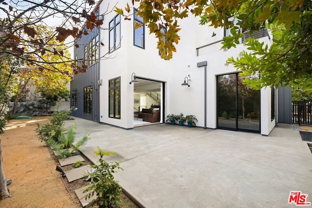 rear view of house with a patio