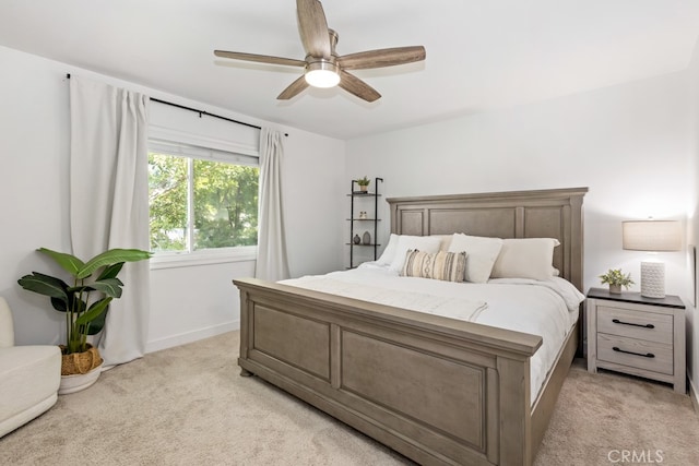 bedroom with light carpet and ceiling fan