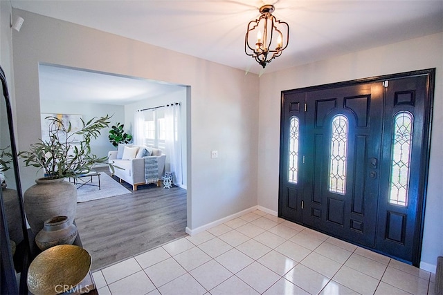 entrance foyer featuring an inviting chandelier and light wood-type flooring