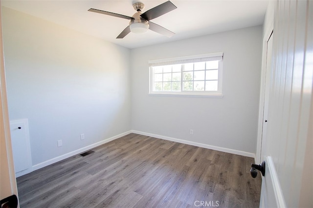 unfurnished room featuring hardwood / wood-style floors and ceiling fan