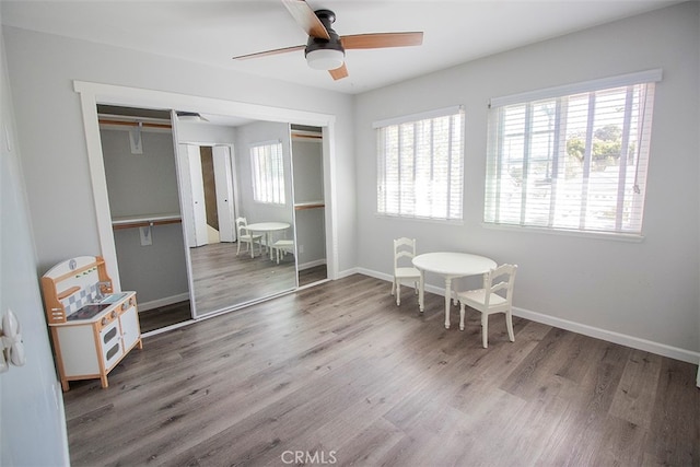 dining area featuring hardwood / wood-style flooring and ceiling fan