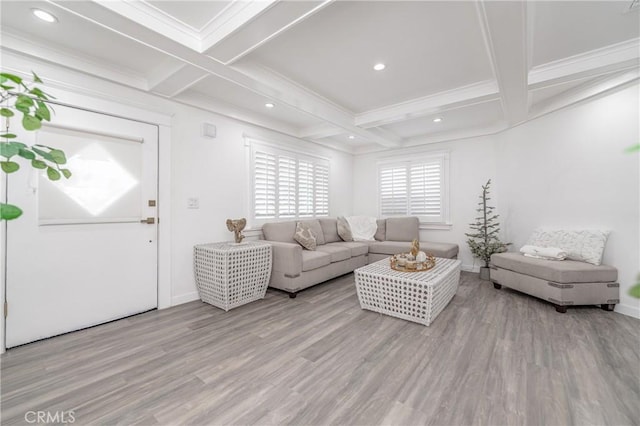 living room with coffered ceiling, light hardwood / wood-style flooring, ornamental molding, and beamed ceiling