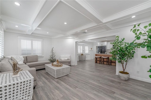 living room featuring beamed ceiling, coffered ceiling, and hardwood / wood-style flooring