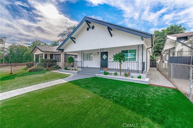 view of front of property with a porch and a front yard