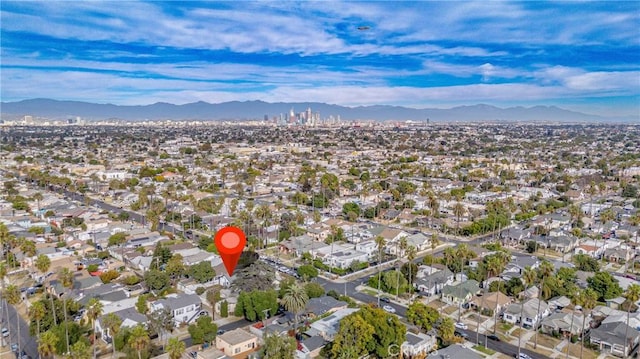 birds eye view of property with a mountain view