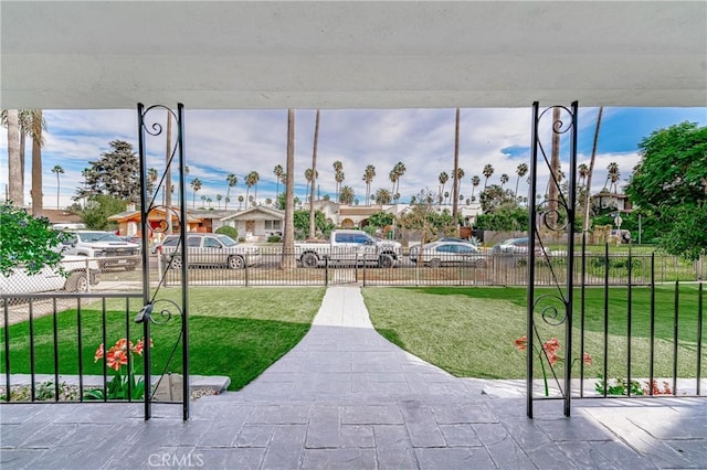 view of property's community featuring a lawn