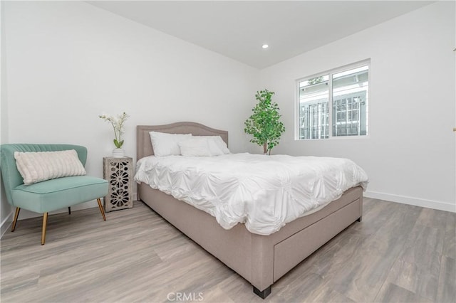 bedroom with hardwood / wood-style floors