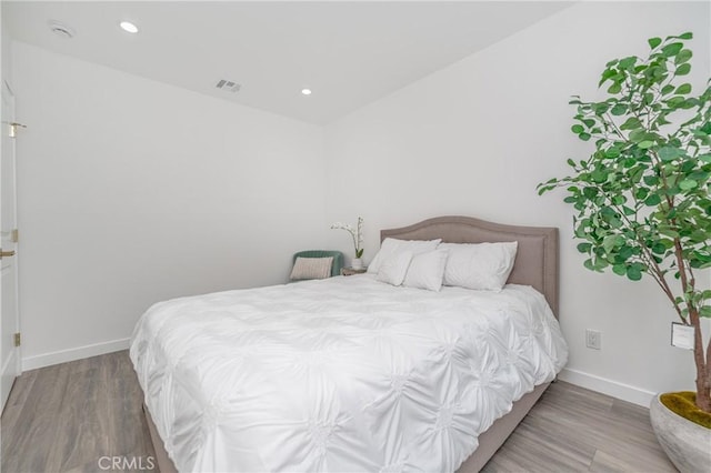 bedroom featuring wood-type flooring